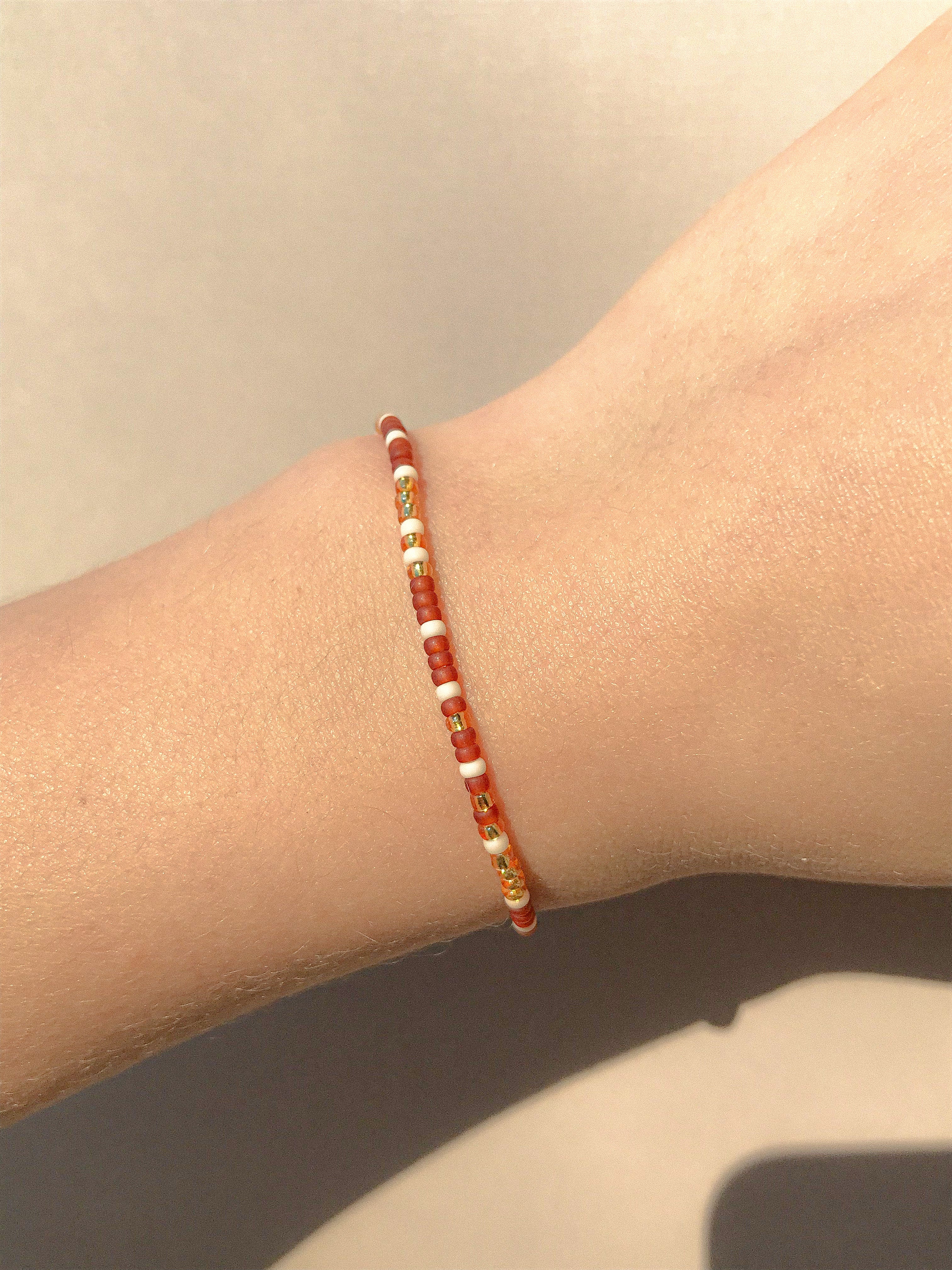 Morse Code Bracelet (orange string) | the-noticed-network